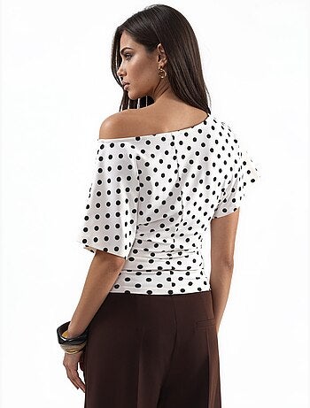 Blouse à pois avec taille ajustée et manches chauve-souris