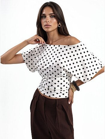 Blouse à pois avec taille ajustée et manches chauve-souris