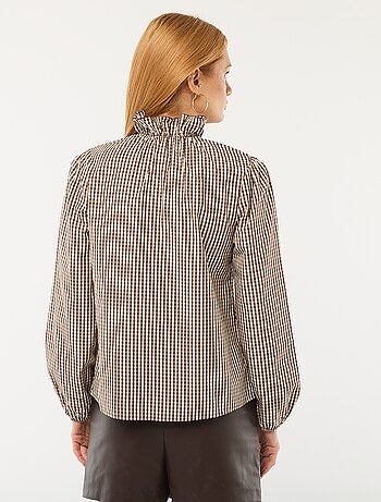 Blouse avec volants au col et à l'ouverture