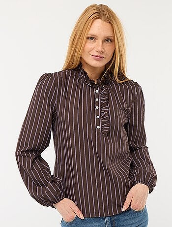 Blouse avec volants au col et à l'ouverture
