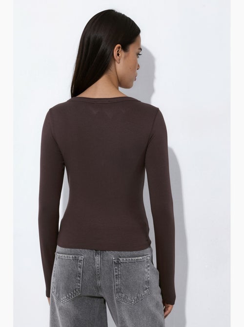 Blouse en maille avec boutons-pression sur toute la longueur devant hiccup - Kiabi Blouse en maille avec boutons-pression sur toute la longueur devant hiccup - Kiabi