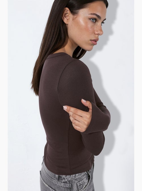 Blouse en maille avec boutons-pression sur toute la longueur devant hiccup - Kiabi Blouse en maille avec boutons-pression sur toute la longueur devant hiccup - Kiabi