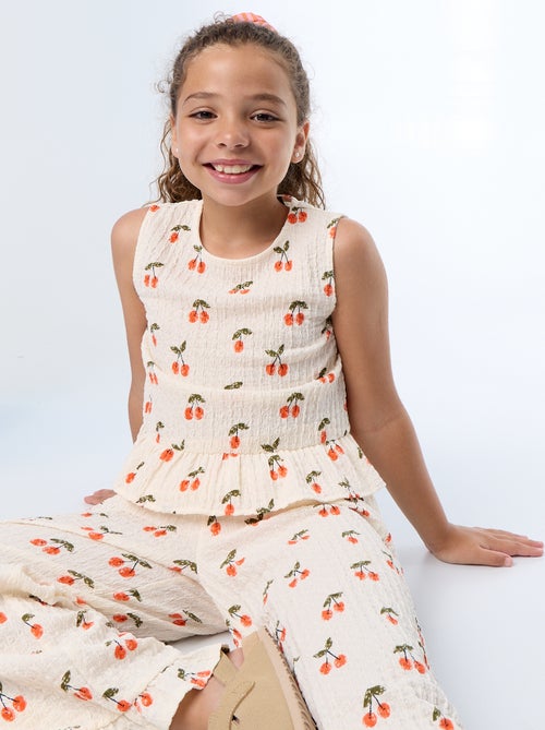 Blouse gaufrée sans manches - Kiabi Blouse gaufrée sans manches - Kiabi