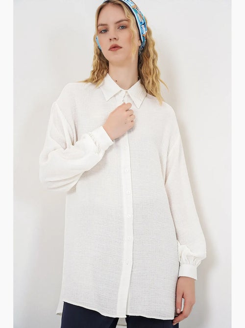 Blouse longue oversize texturée avec col chemise bdart - Kiabi Blouse longue oversize texturée avec col chemise bdart - Kiabi
