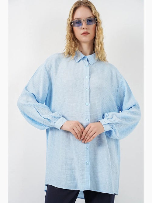 Blouse longue oversize texturée avec col chemise bdart - Kiabi Blouse longue oversize texturée avec col chemise bdart - Kiabi