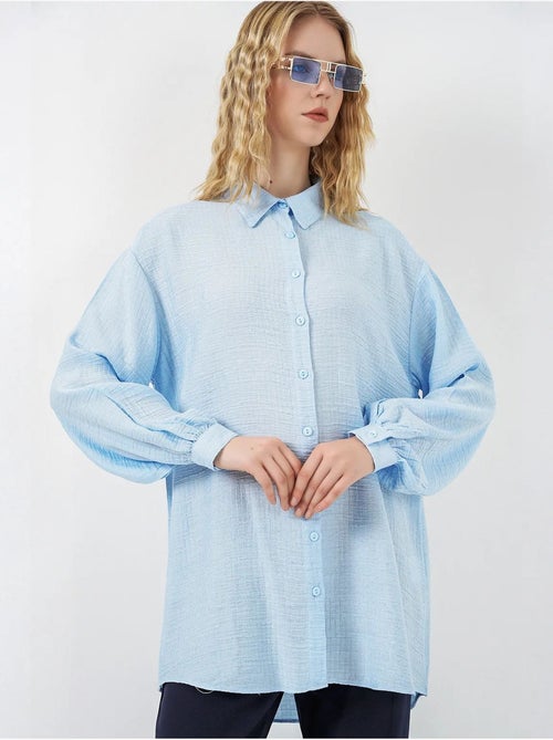 Blouse longue oversize texturée avec col chemise bdart - Kiabi Blouse longue oversize texturée avec col chemise bdart - Kiabi