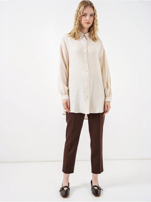 Blouse longue oversize texturée avec col chemise bdart - Kiabi Blouse longue oversize texturée avec col chemise bdart - Kiabi
