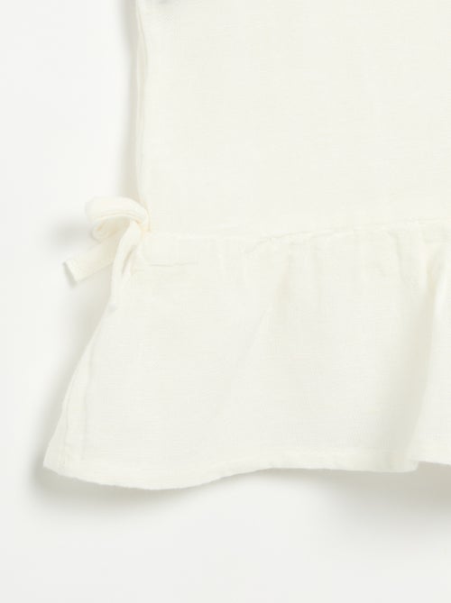 Blouse rayée avec nœuds fantaisie - Kiabi Blouse rayée avec nœuds fantaisie - Kiabi