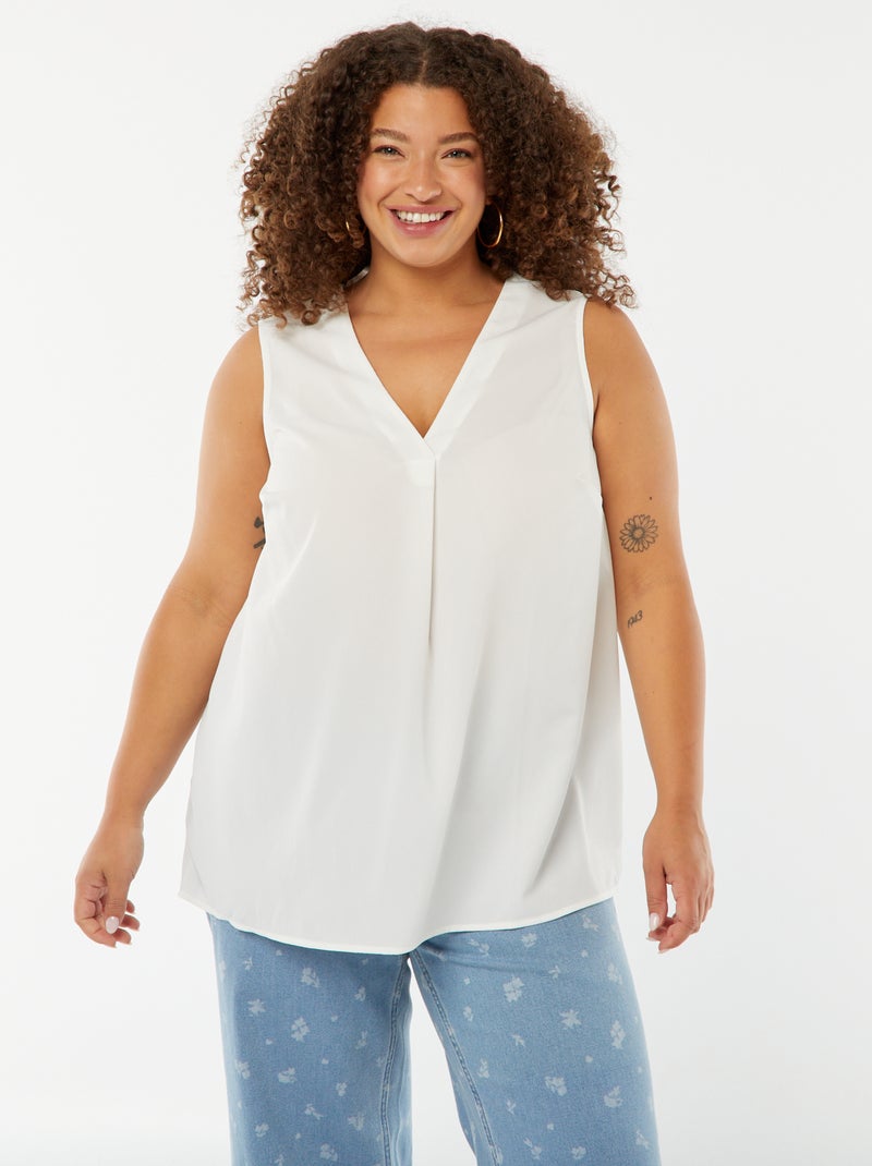 Blouse uni avec couture fantaisie au col blanc - Kiabi