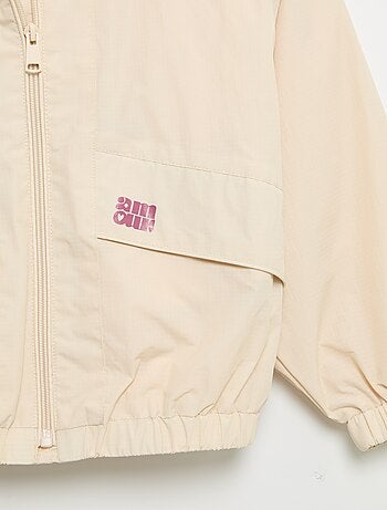 Blouson coupe-vent à capuche