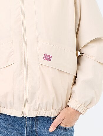 Blouson coupe-vent à capuche