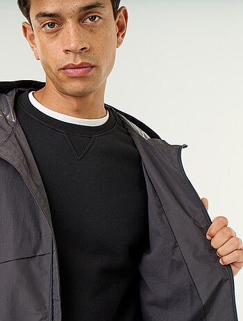 Blouson coupe-vent à capuche déperlant