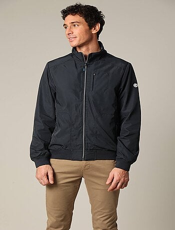 Blouson court en toile enduite noire avec col montant 'Deeluxe'