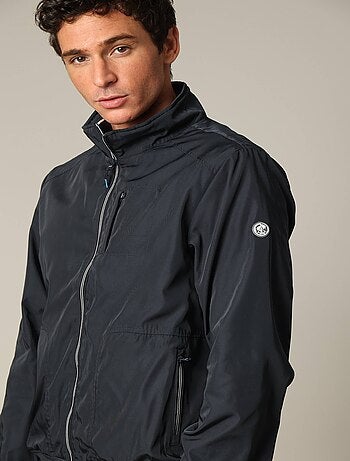Blouson court en toile enduite noire avec col montant 'Deeluxe'
