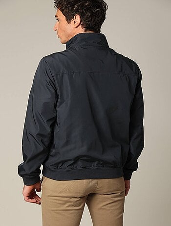 Blouson court en toile enduite noire avec col montant 'Deeluxe'