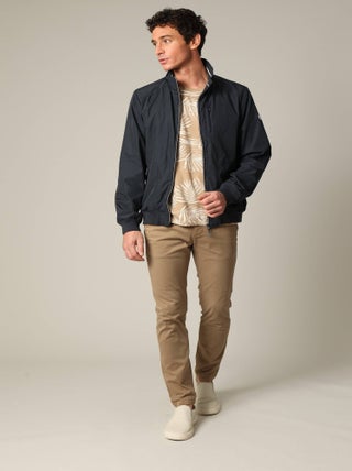 Blouson court en toile enduite noire avec col montant 'Deeluxe'