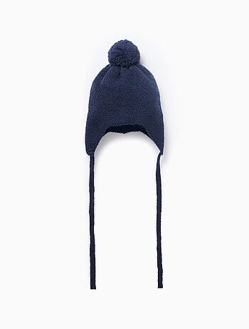 Bonnet en maille avec lien à nouer et pompon
