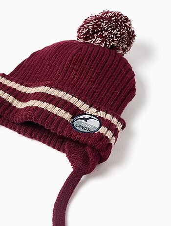 Bonnet en maille avec lien à nouer et pompon