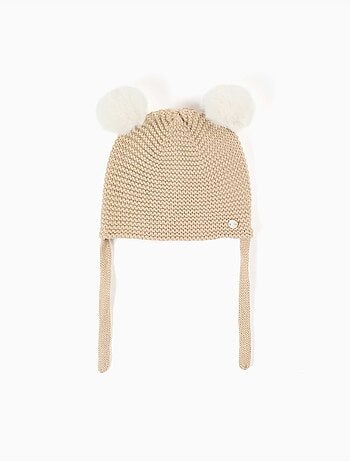Bonnet en maille avec pompons et liens à nouer