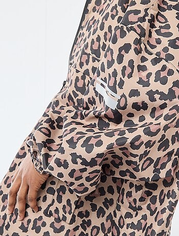 Cape de pluie déperlante avec capuche avec astuce pliage sur elle-même