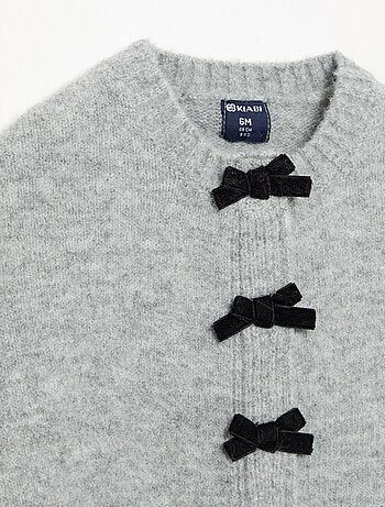Cape en tricot avec nœuds en velours