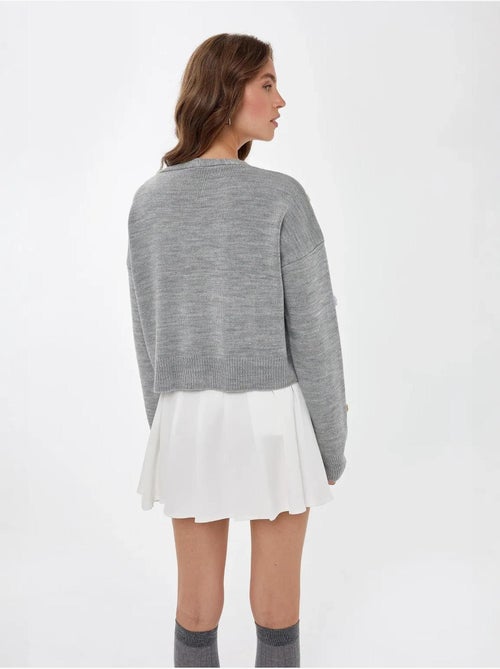 Cardigan fleuri à col en V et coupe décontractée - Kiabi Cardigan fleuri à col en V et coupe décontractée - Kiabi