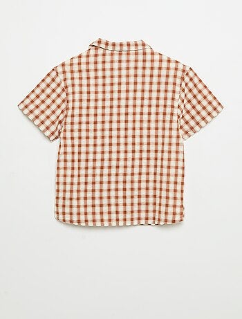 Chemise à carreaux et manches courtes