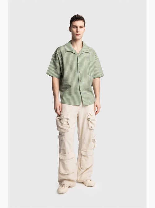 Chemise à manches courtes rayée texturée avec poche giesto - Kiabi Chemise à manches courtes rayée texturée avec poche giesto - Kiabi