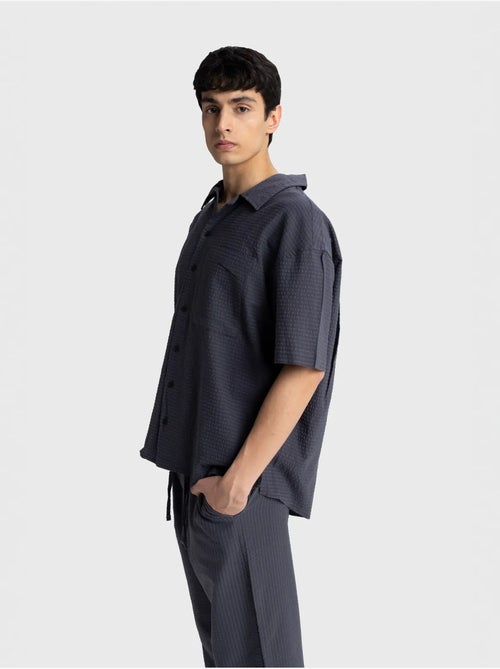 Chemise boutonnée en coton texturé avec poche giesto - Kiabi