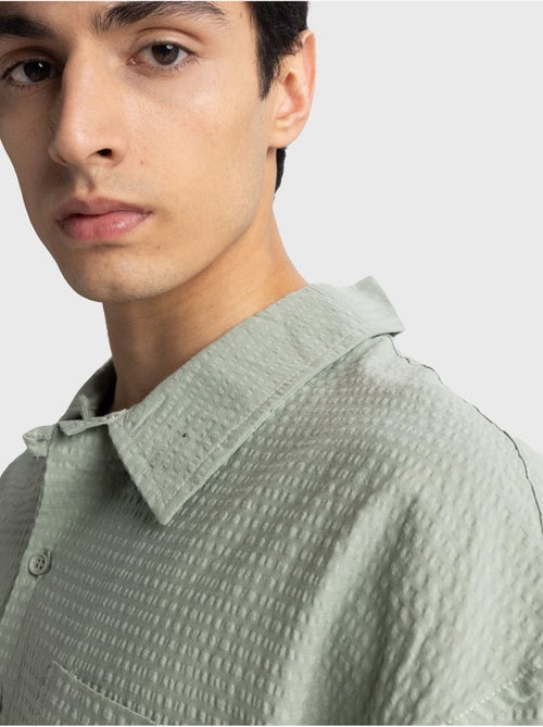 Chemise boutonnée en coton texturé avec poche giesto - Kiabi