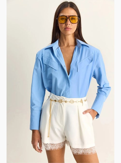 Chemise décontractée en popeline boutonnée à manches longues avec poche lucci - Kiabi Chemise décontractée en popeline boutonnée à manches longues avec poche lucci - Kiabi