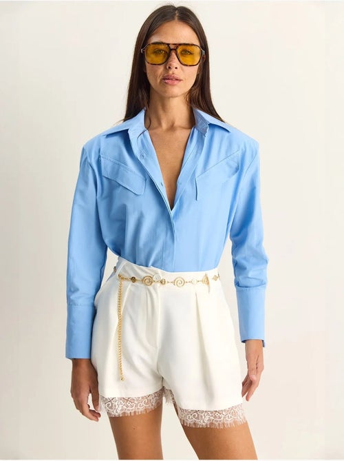 Chemise décontractée en popeline boutonnée à manches longues avec poche lucci - Kiabi Chemise décontractée en popeline boutonnée à manches longues avec poche lucci - Kiabi
