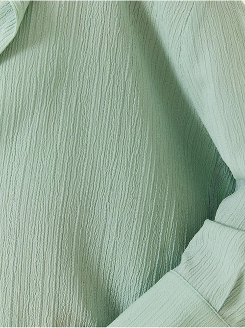 Chemise froissée basique surdimensionnée à épaules dénudées lucci - Kiabi Chemise froissée basique surdimensionnée à épaules dénudées lucci - Kiabi