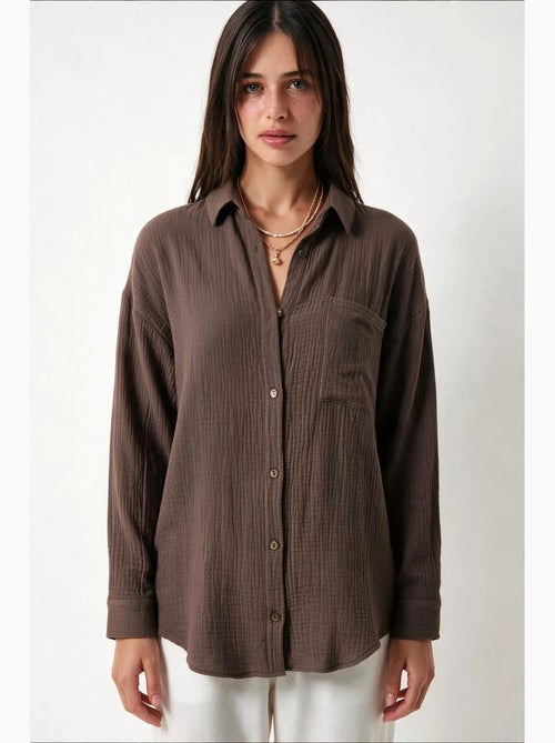 Chemise oversize en coton texturé avec poche istanbul - Kiabi Chemise oversize en coton texturé avec poche istanbul - Kiabi