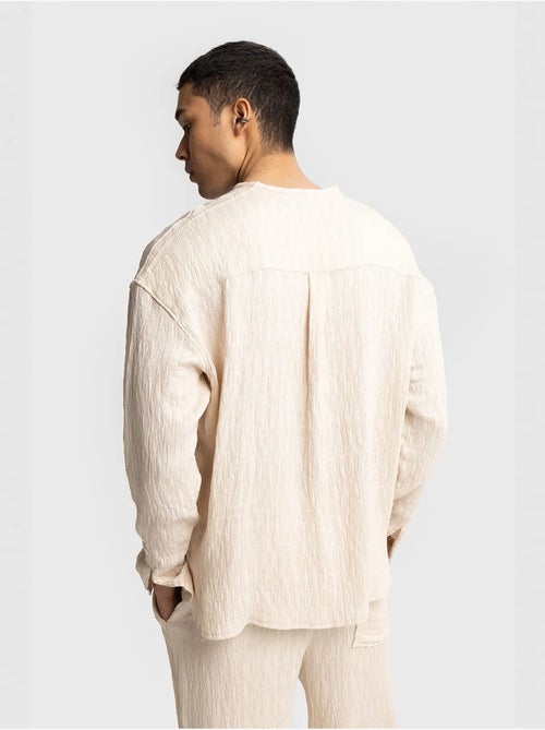 Chemise texturée à manches longues et col rond giesto - Kiabi Chemise texturée à manches longues et col rond giesto - Kiabi