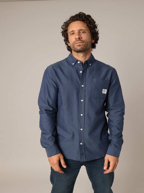 Chemise unie avec poche plaquée ornée d'un patch signature. 'Deeluxe' - Kiabi