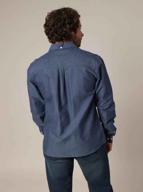 Chemise unie avec poche plaquée ornée d'un patch signature. 'Deeluxe' - Kiabi