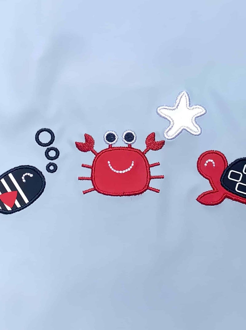 Ciré imperméable bébé avec Capuche 'Breizh Ocean', Poncho Intérieur rayé avec Broderie Bleu ciel - Kiabi