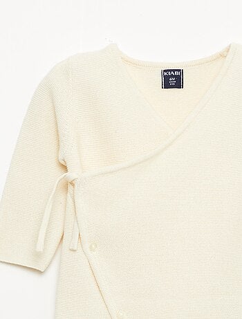 Combinaison en tricot avec ouverture cache-cœur