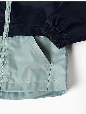 Coupe-vent à capuche et poches