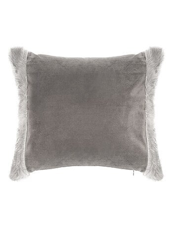 Coussin avec bordures en imitation fourrure