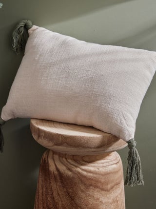 Coussin avec pompons