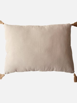 Coussin avec pompons en jute