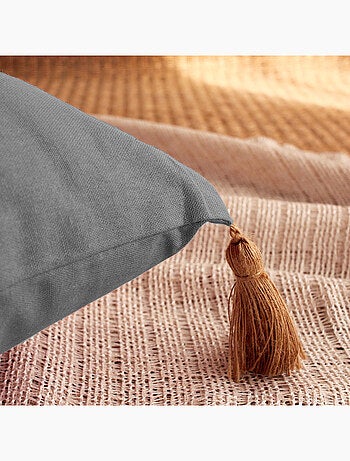 Coussin avec pompons en jute