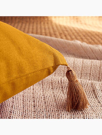 Coussin avec pompons en jute