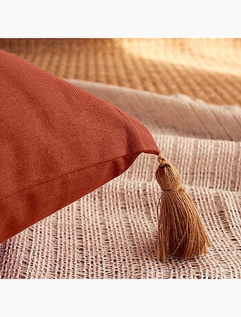 Coussin avec pompons en jute