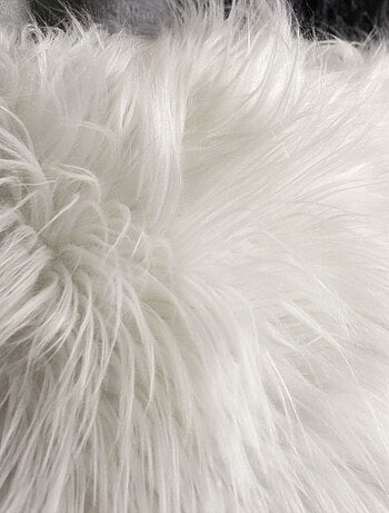 Coussin déhoussable uni imitation fourrure