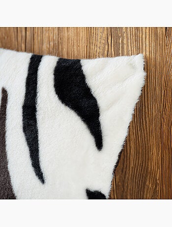 Coussin garni à motif zèbre avec dos en velours