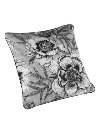 Coussin passepoilé aux impressions florales