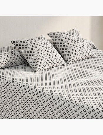 Couvre-lit en coton avec motif géométrique en relief, tissu texturé.